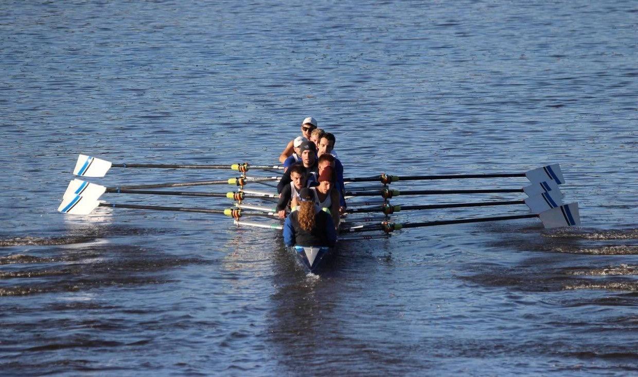 Rowing team trains on Grand River for competition.